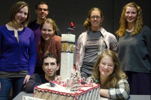 Students standing next to their gingerbread Bromo Seltzer Tower construction