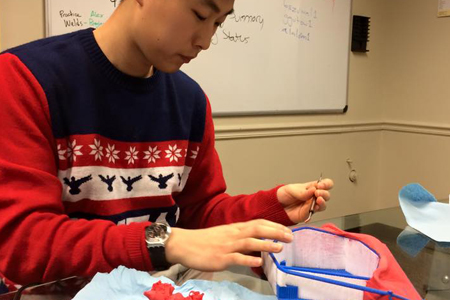 A student works on his model.