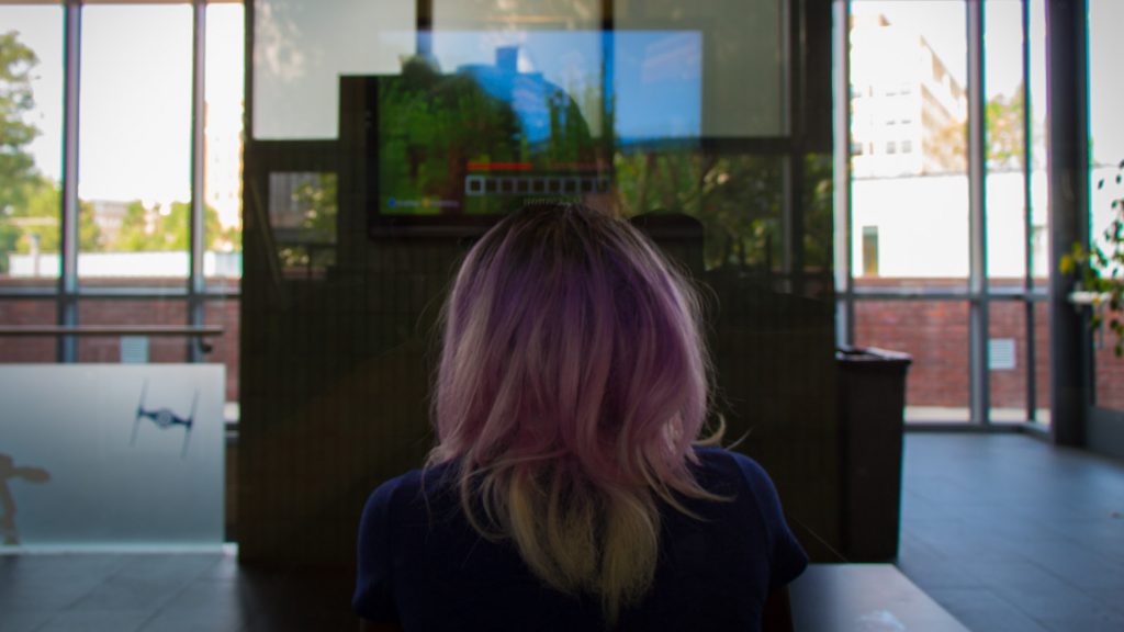 Student playing in gaming lounge