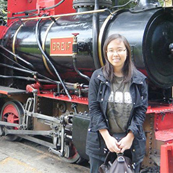 Alane in front of a train