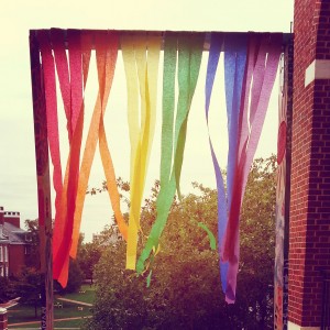 Rainbow-colored ribbons hanging in the air.