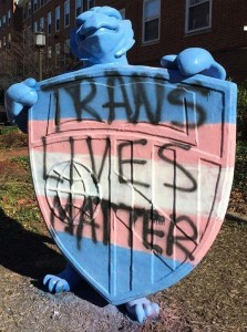 Blue Jay statue with "Trans Lives Matter" written across shield