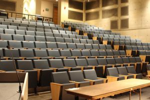 Empty classroom showing theater stadium seating.