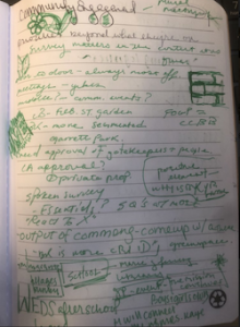 notebook with notes written in green ink