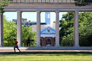 Person running during the summer on campus