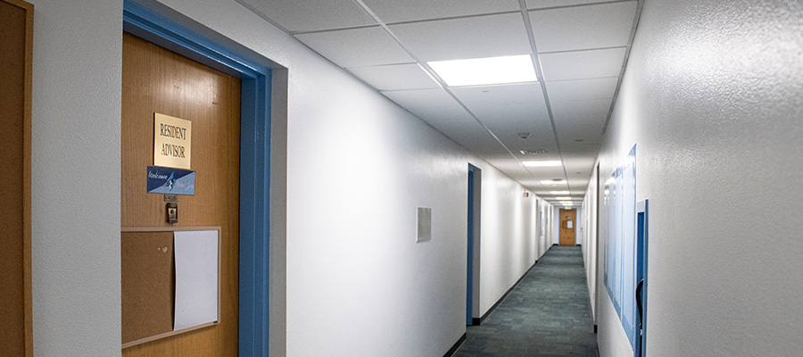 An empty residence hall hallway