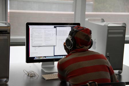 Student editing music on a computer