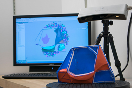 Scanning device reads object for Baja design test