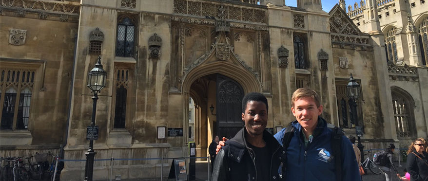 Students pose in front of church in Cambridge