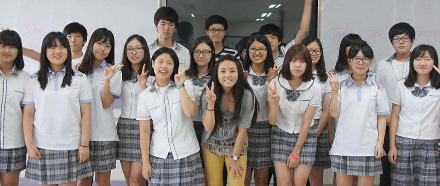 Mary Han, ETA to South Korea, posing with group of students