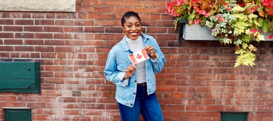 Ashley posing with Canadian flag