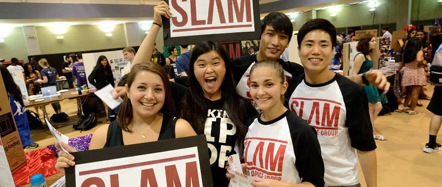 Students holding up signs during Student Involvement Fair.