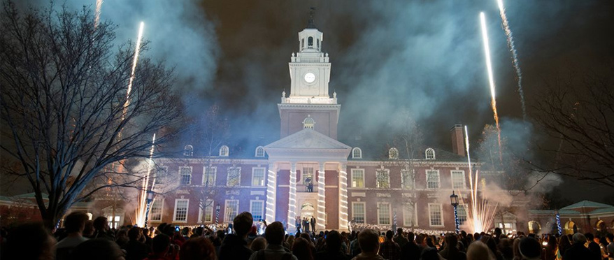 Fireworks over Gilman Hall during Lighting of the Quad