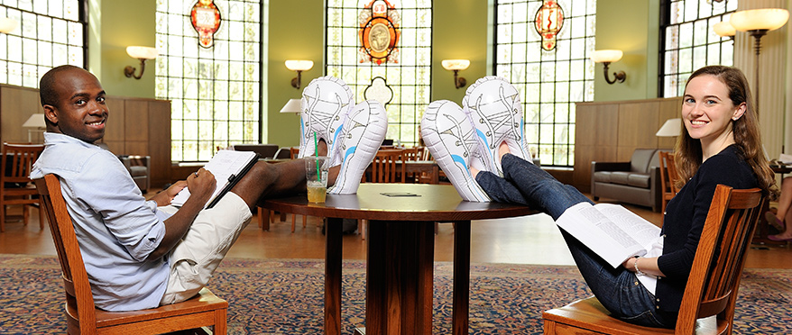 Students sitting in chairs in the HUD
