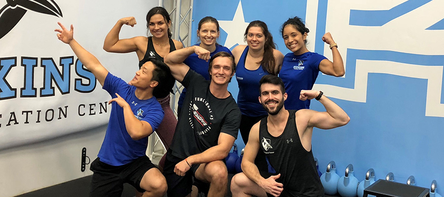 F45 trainers flexing muscles
