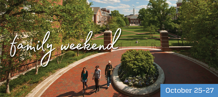 An aerial view of campus featuring lush lawns, full green trees, and Shriver Hall in the distance.