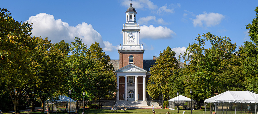 An exterior photo of Gilman Hall on a sunny day in autumn