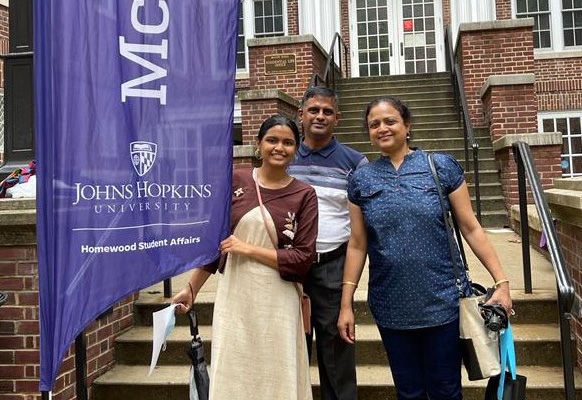Priya Vijay and her family on the steps of McCoy Hall