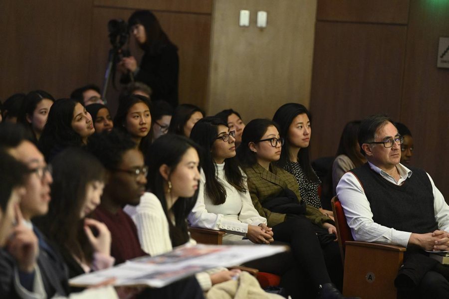 Students listen to a speaker.