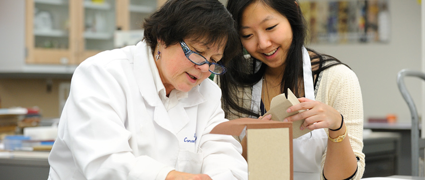 Student and faculty member in lab