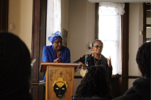 Dr. Joanne Martin and Janice the Griot Greene talking in front of students