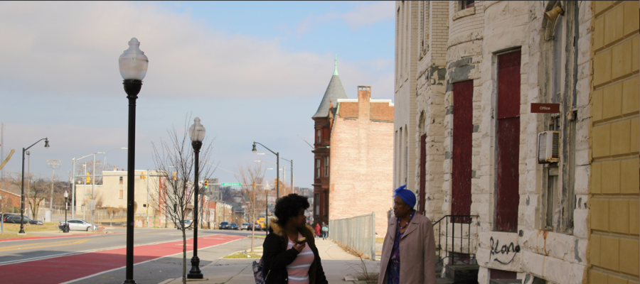 Dr. Joanne Martin and a student talking outside the museum in Baltimore City