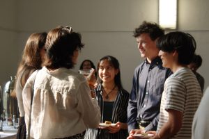 Andion Dizon smiling while talking to some of the CSC graduating seniors.