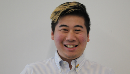 Headshot of Frank Meng smiling against a white background