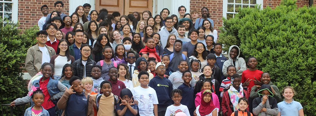 A group photo of Tutorial Project students and tutors on the steps of Levering Hall