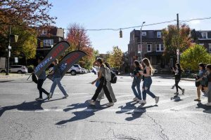 Hopkins Votes ambassadors leading students across the street to go vote