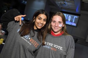 Students in Hopkins Votes shirts smiling 