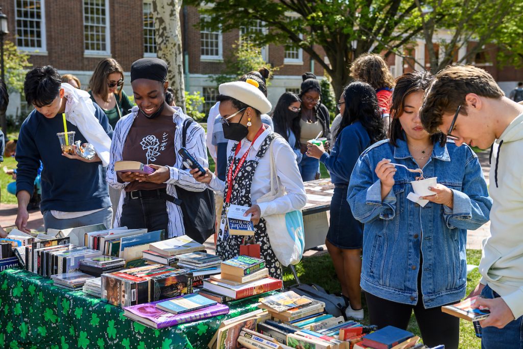 Students browse books at the Art Market during Spring Fair.