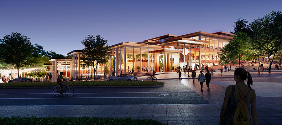 External view of proposed Student Center design at dusk with students walking towards the building.